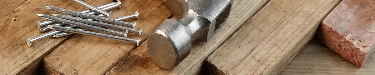 Hammer and nails on hardwood flooring boards in Los Angeles, CA