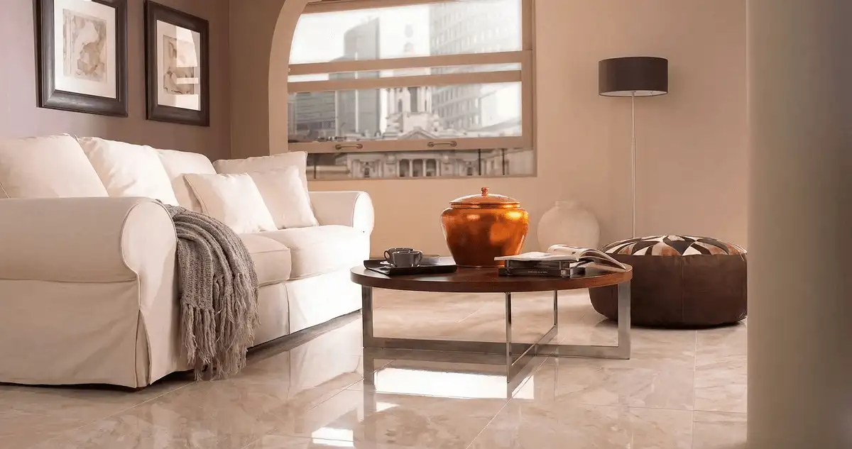 Modern living room with professionally installed marble flooring, a beige sofa, coffee table in Los Angeles, CA