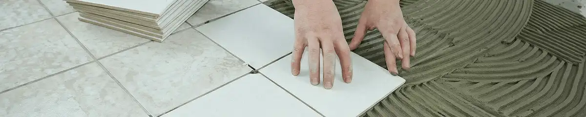 Professional installing white tile floors in Los Angeles, CA