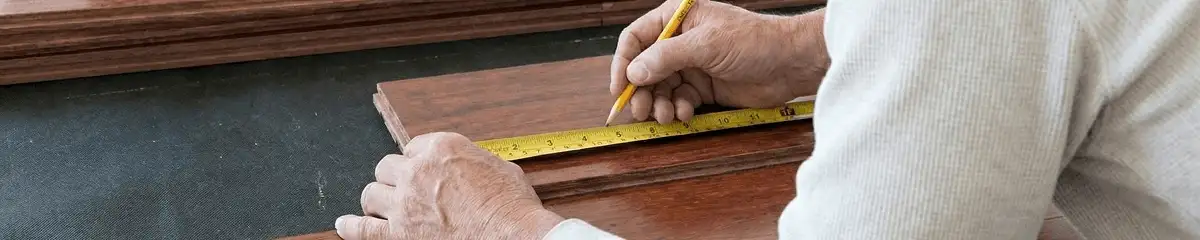 A professional installing wood flooring in Los Angeles, CA